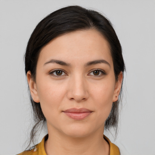 Joyful white young-adult female with medium  brown hair and brown eyes