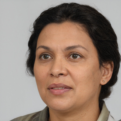 Joyful white adult female with medium  brown hair and brown eyes