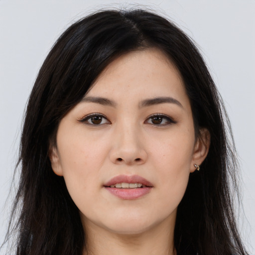 Joyful asian young-adult female with long  brown hair and brown eyes