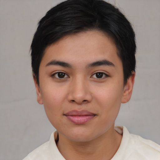 Joyful asian young-adult female with short  black hair and brown eyes