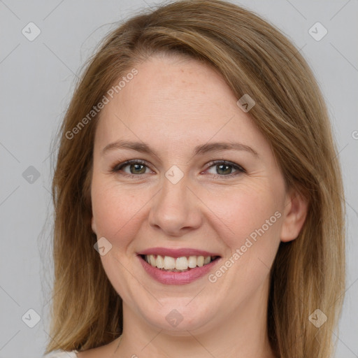 Joyful white adult female with medium  brown hair and brown eyes