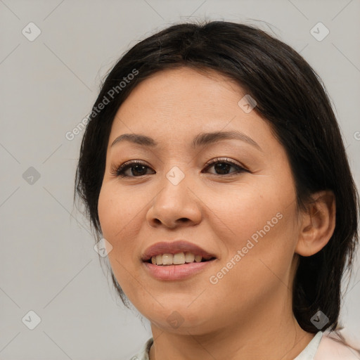 Joyful asian young-adult female with medium  brown hair and brown eyes