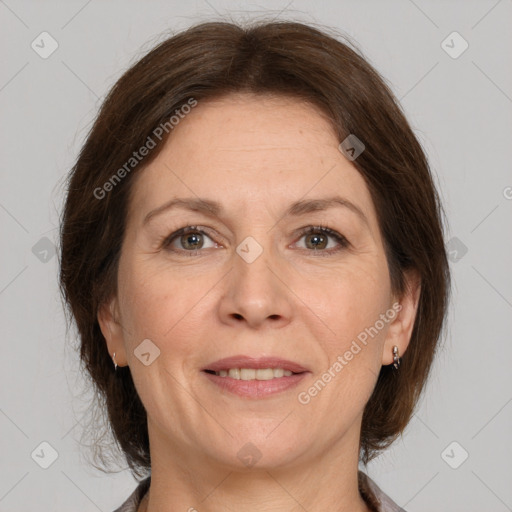 Joyful white adult female with medium  brown hair and brown eyes