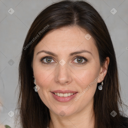 Joyful white adult female with long  brown hair and brown eyes