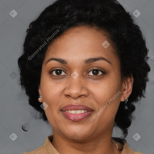 Joyful black adult female with medium  brown hair and brown eyes