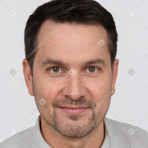 Joyful white adult male with short  brown hair and brown eyes