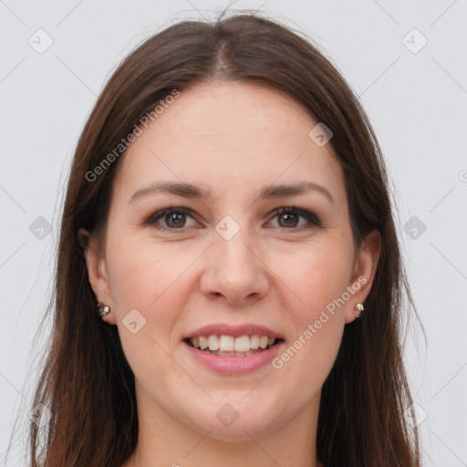 Joyful white young-adult female with long  brown hair and grey eyes