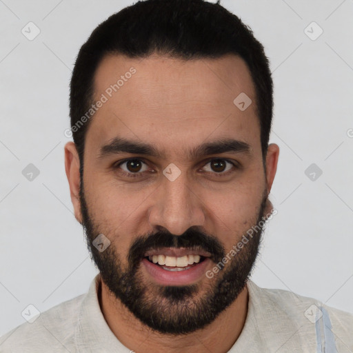 Joyful white young-adult male with short  black hair and brown eyes