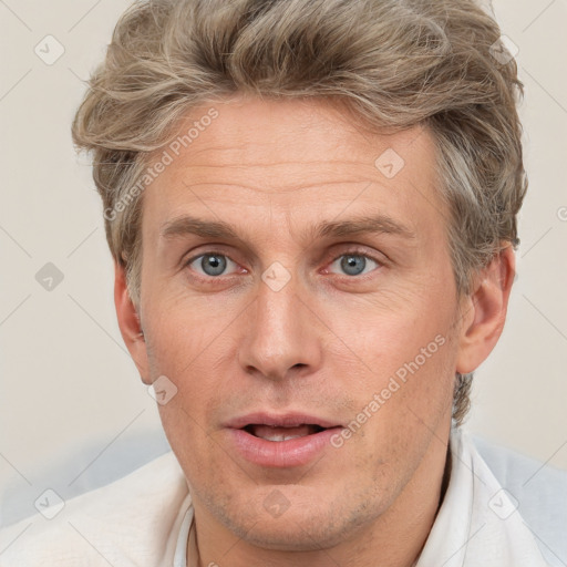 Neutral white adult male with short  brown hair and grey eyes