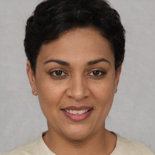 Joyful white young-adult female with short  black hair and brown eyes