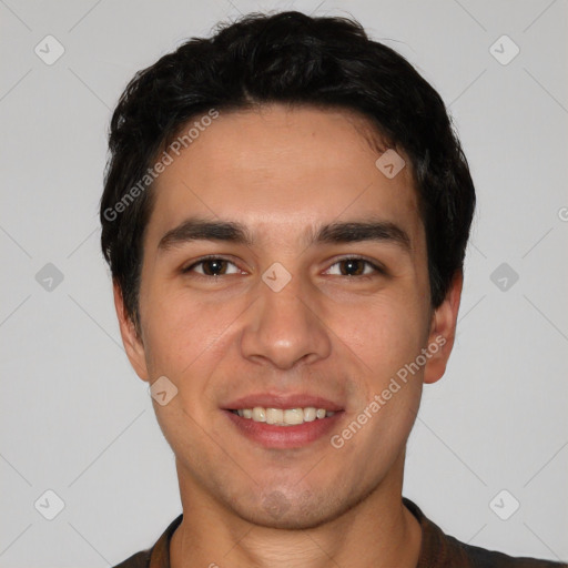 Joyful white young-adult male with short  black hair and brown eyes