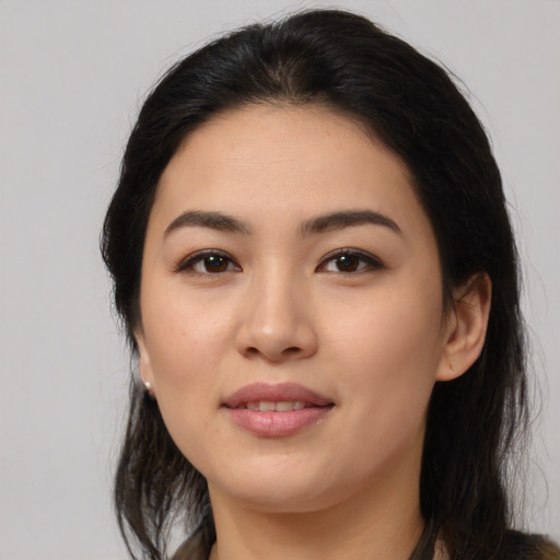 Joyful latino young-adult female with medium  black hair and brown eyes