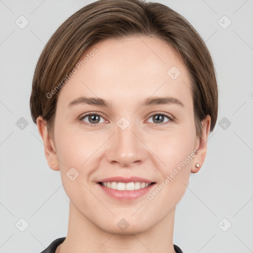 Joyful white young-adult female with short  brown hair and grey eyes