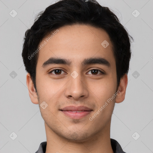 Joyful white young-adult male with short  black hair and brown eyes