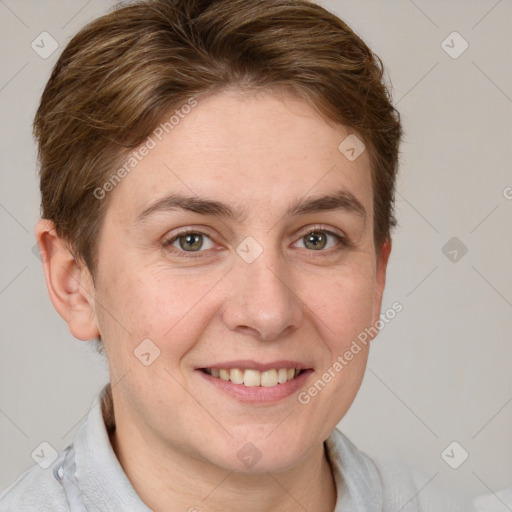 Joyful white adult female with short  brown hair and grey eyes