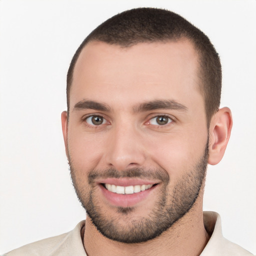 Joyful white young-adult male with short  brown hair and brown eyes