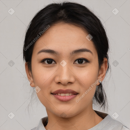 Joyful asian young-adult female with medium  black hair and brown eyes