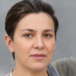 Joyful white adult female with short  brown hair and brown eyes