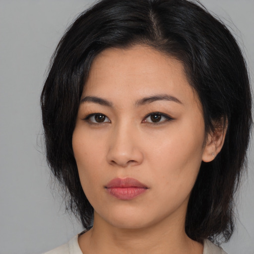Neutral asian young-adult female with medium  black hair and brown eyes