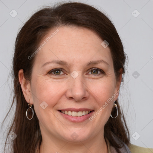 Joyful white adult female with medium  brown hair and grey eyes