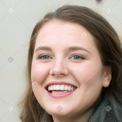 Joyful white young-adult female with long  brown hair and green eyes