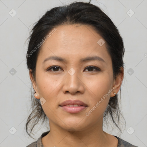 Joyful asian young-adult female with medium  brown hair and brown eyes