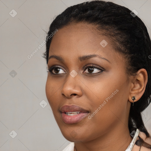 Joyful black young-adult female with medium  black hair and brown eyes