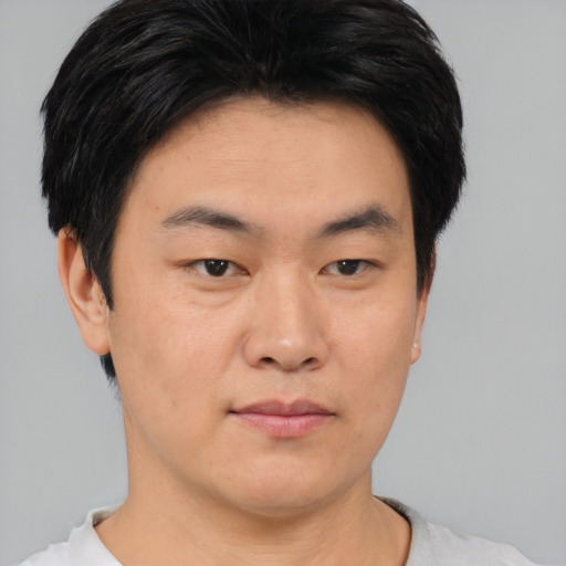 Neutral asian young-adult male with short  brown hair and brown eyes