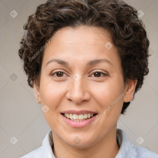 Joyful white adult female with short  brown hair and brown eyes