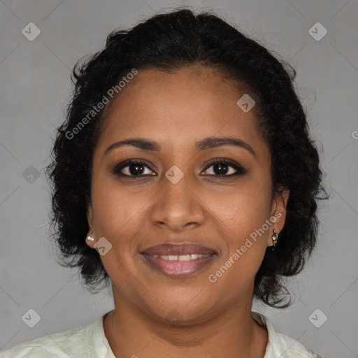 Joyful black young-adult female with medium  brown hair and brown eyes