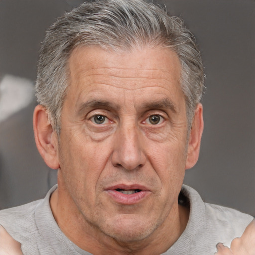 Neutral white middle-aged male with short  gray hair and brown eyes