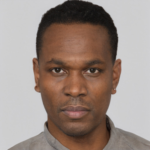 Neutral black young-adult male with short  black hair and brown eyes