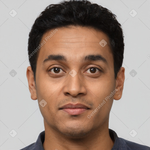 Joyful latino young-adult male with short  black hair and brown eyes