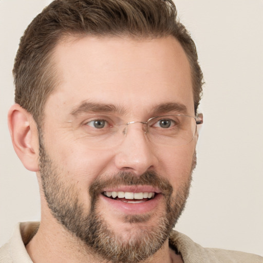 Joyful white adult male with short  brown hair and grey eyes