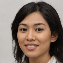 Joyful asian young-adult female with medium  black hair and brown eyes