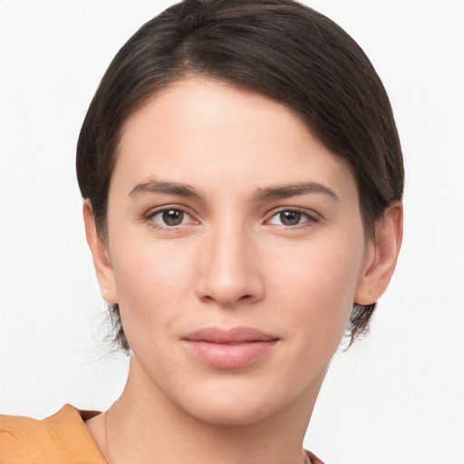 Joyful white young-adult female with medium  brown hair and brown eyes