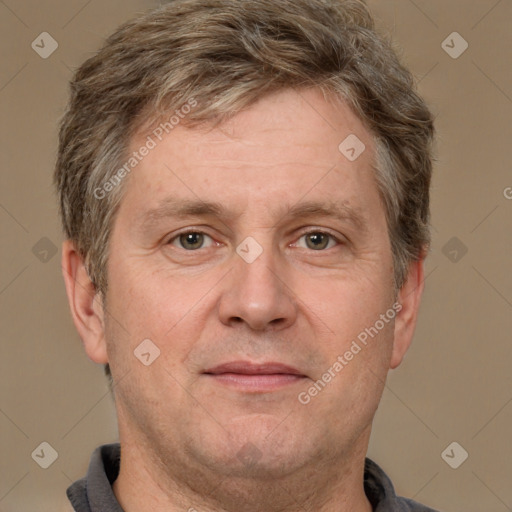 Joyful white adult male with short  brown hair and grey eyes