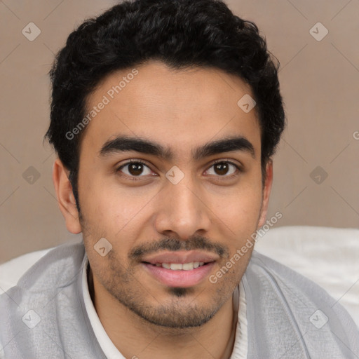 Joyful latino young-adult male with short  black hair and brown eyes