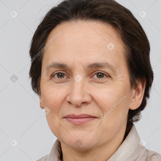 Joyful white adult female with medium  brown hair and brown eyes