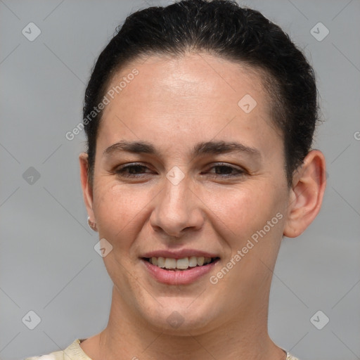 Joyful white young-adult female with short  brown hair and brown eyes