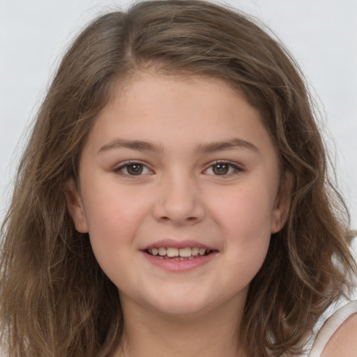 Joyful white child female with long  brown hair and brown eyes