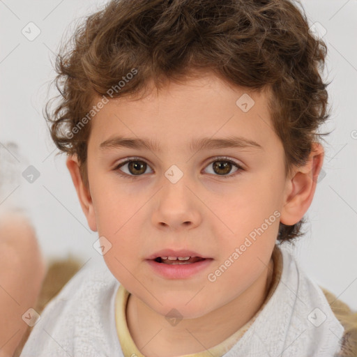 Joyful white child male with short  brown hair and brown eyes