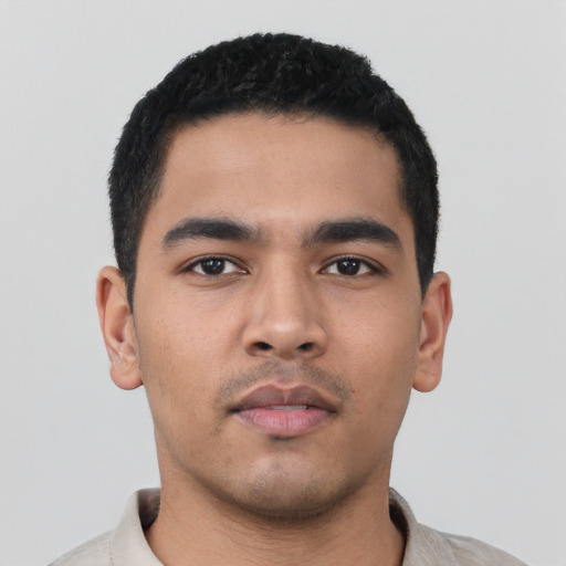 Neutral latino young-adult male with short  black hair and brown eyes