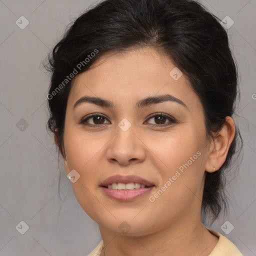 Joyful latino young-adult female with medium  brown hair and brown eyes