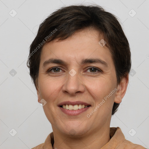 Joyful white adult female with short  brown hair and brown eyes