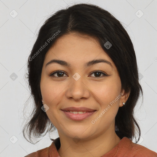 Joyful latino young-adult female with medium  brown hair and brown eyes