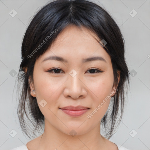 Joyful asian young-adult female with medium  brown hair and brown eyes