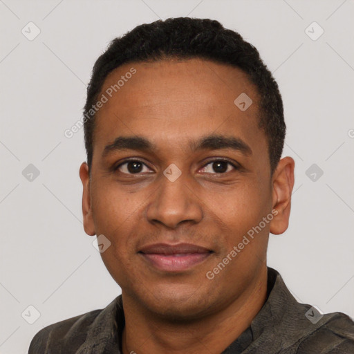 Joyful black young-adult male with short  black hair and brown eyes