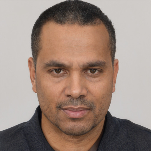 Neutral white adult male with short  black hair and brown eyes