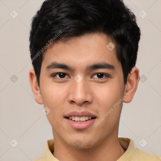 Joyful asian young-adult male with short  black hair and brown eyes